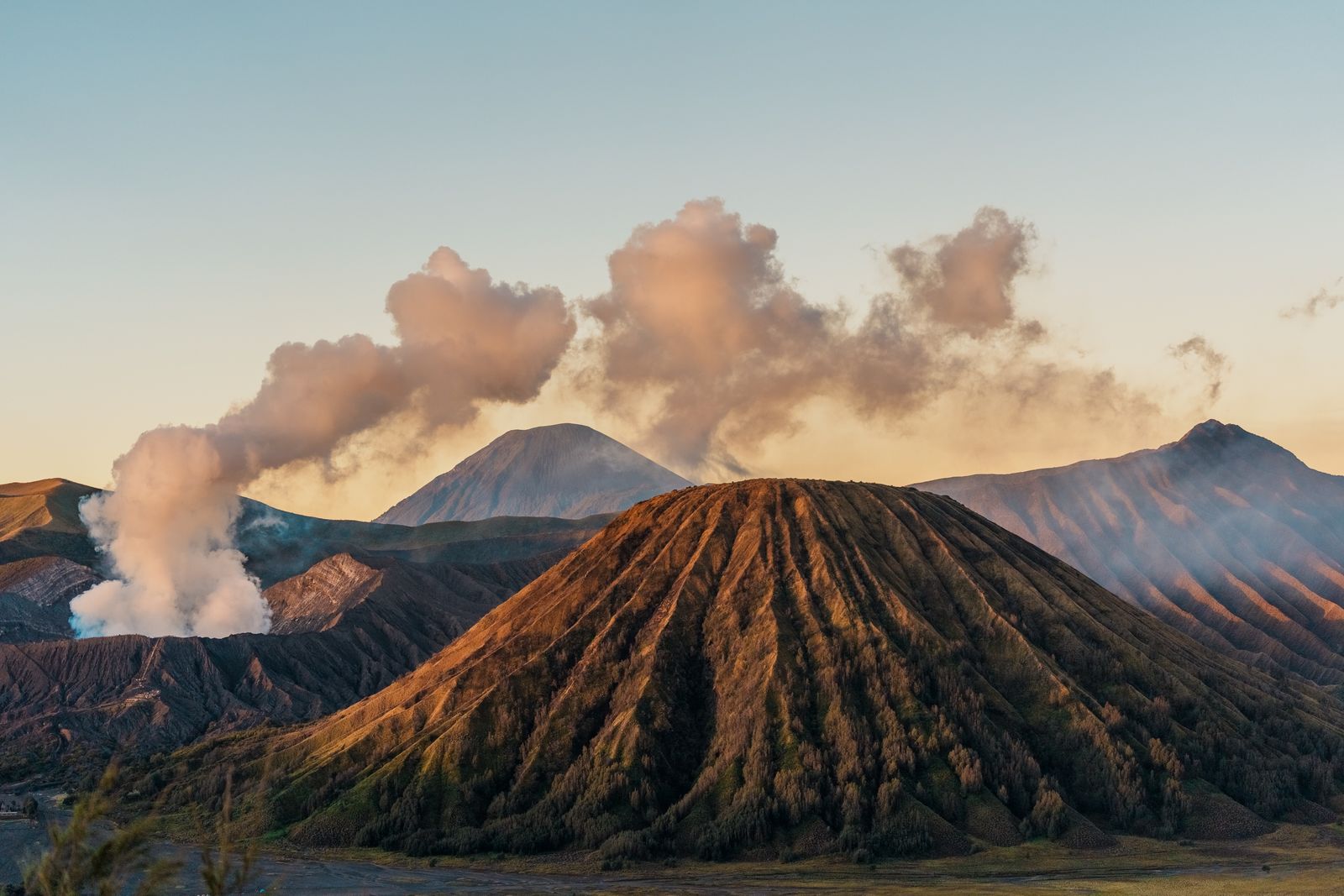 Active volcano releasing smoke over the landscape