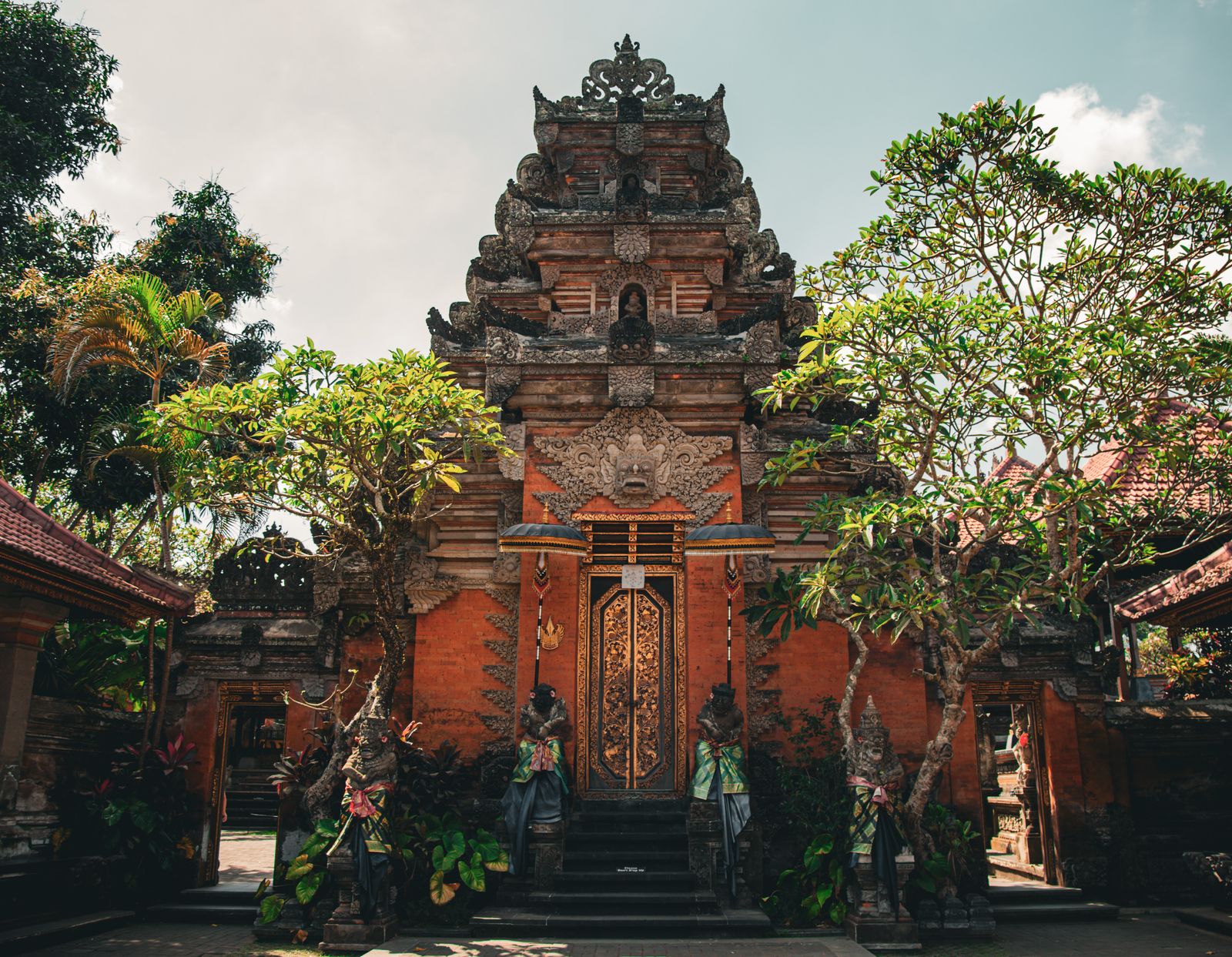 Traditional Balinese temple gate with carved stone details