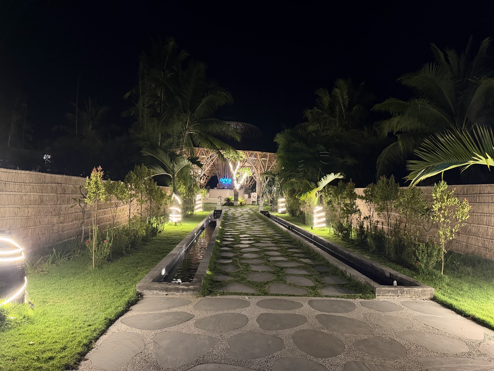 Lit garden path at night