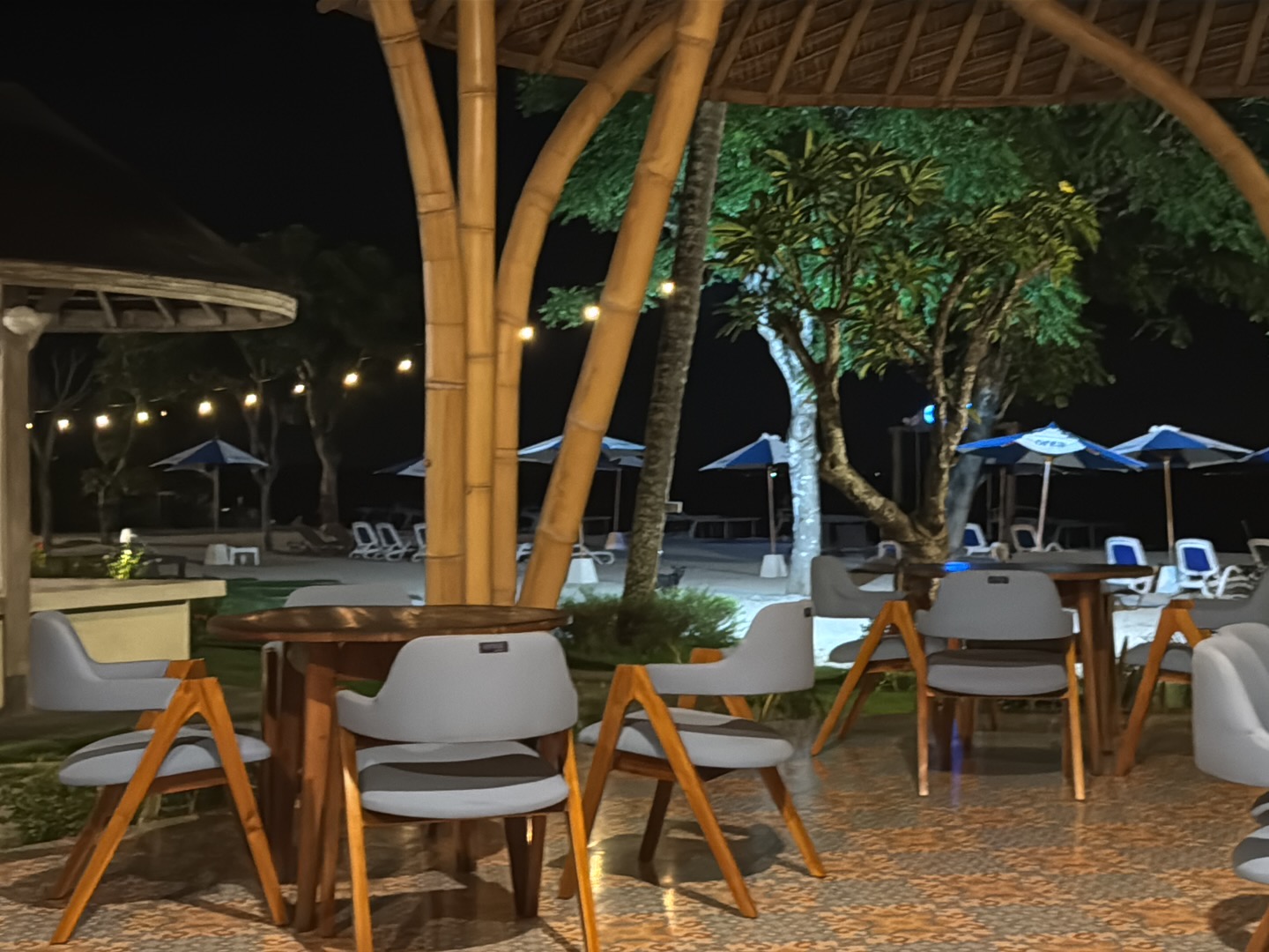 Lantern-lit seating area at night