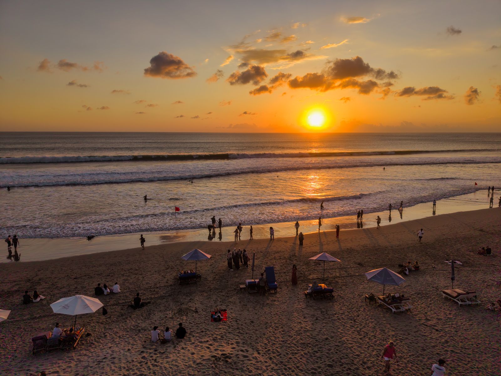 Sunset over a busy beach