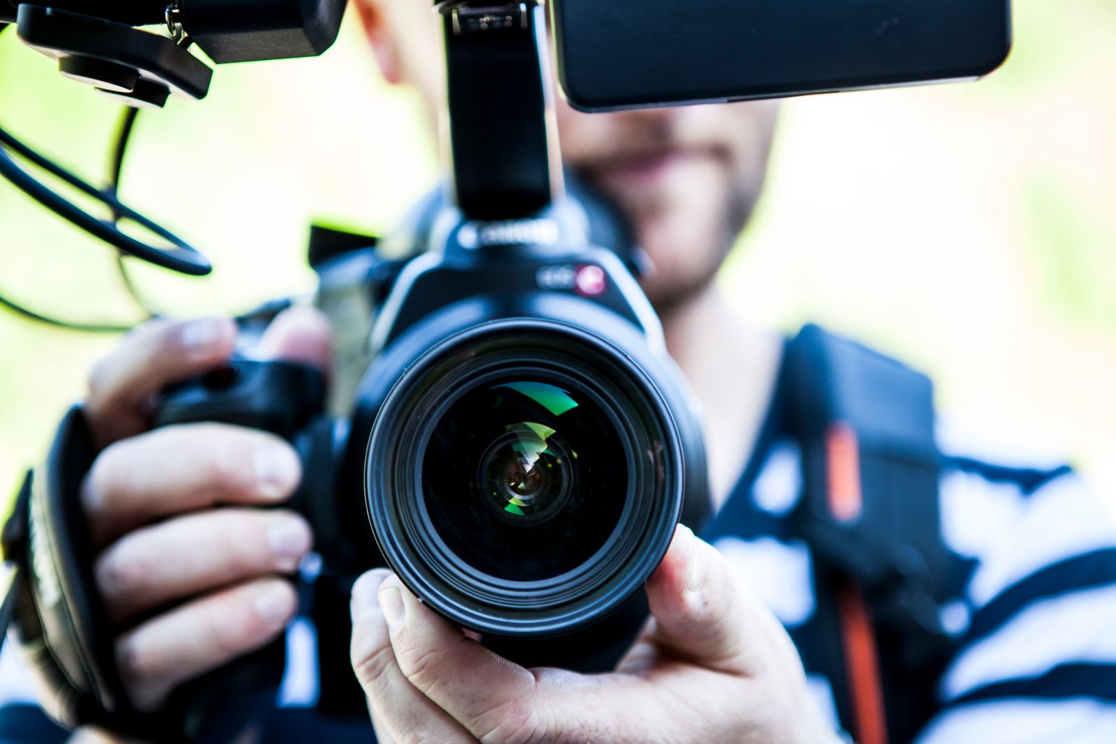Traveller holding a camera, one of the valuables worth insuring
