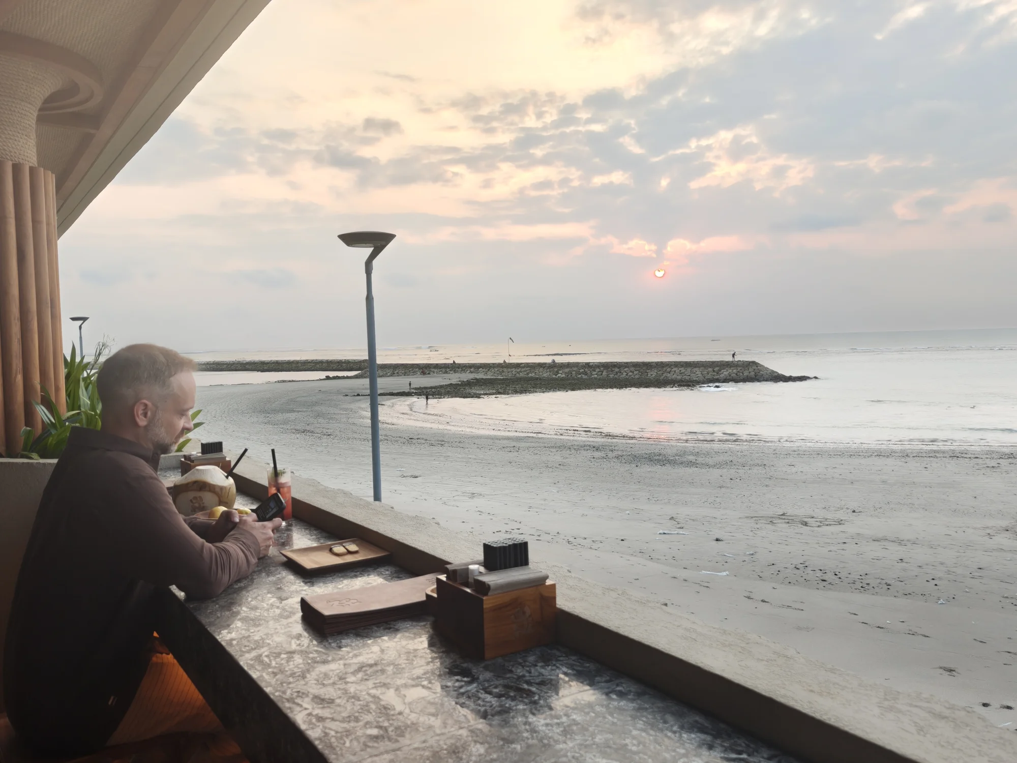 Guest relaxing by the beachfront with views of the Kuta shoreline